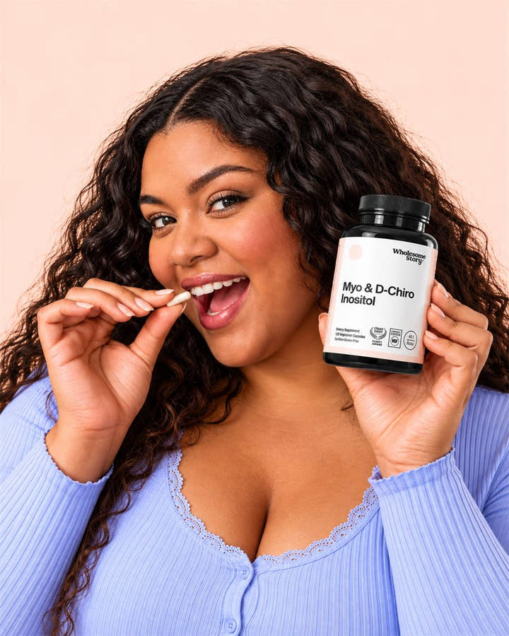 A smiling woman holding a bottle of Wholesome Story Myo-Inositol and D-Chiro Inositol