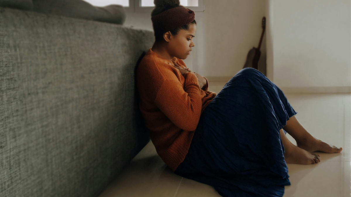 Anxious Woman With Hands On Her Chest 